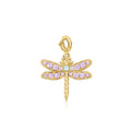Gold dragonfly charm with purple stones and blue center, on a hinged loop