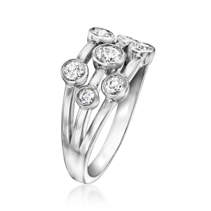 Sterling silver ring with bezel-set round diamonds on an openwork split shank