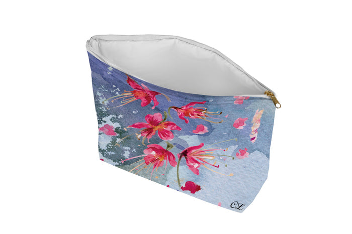 Floral patterned pouch on a blue background