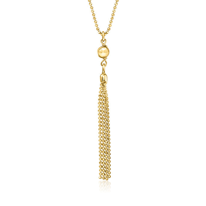 Gold-tone bead tassel necklace with round charm and long dangling chain tassel