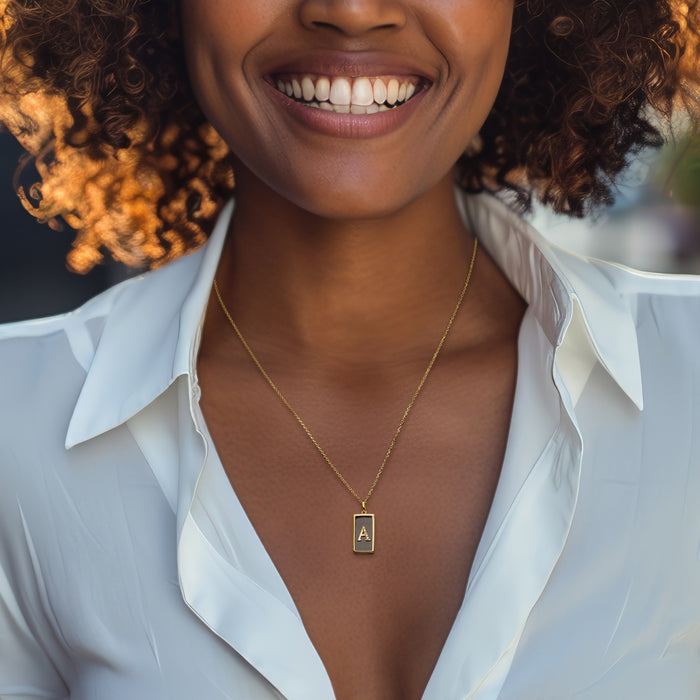 Gold initial pendant necklace with dark onyx square, A, diamond accents