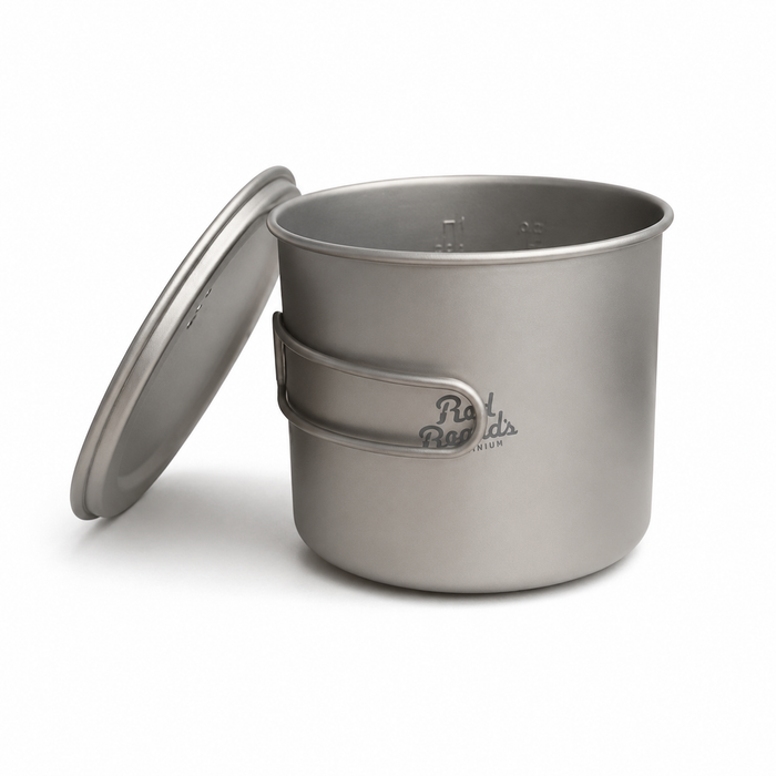 Close view of the 1.1 L titanium backpacking pot with lid and interior measurement markings