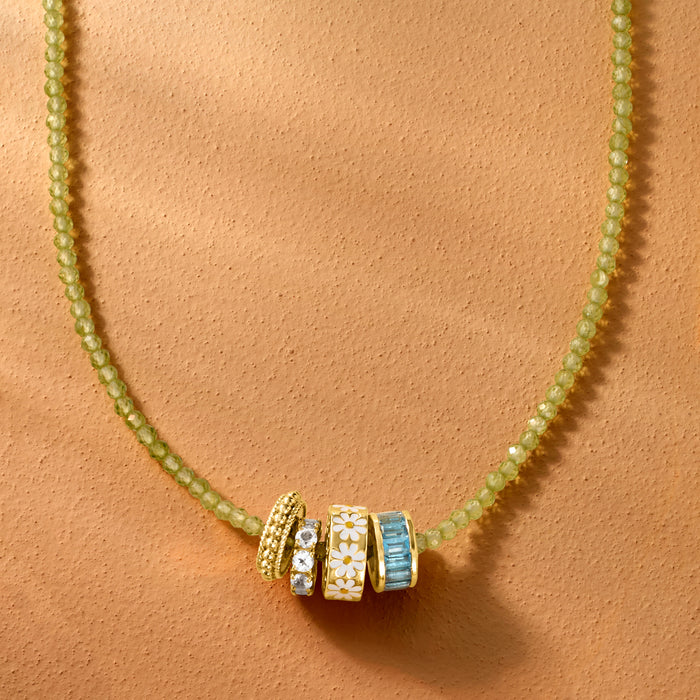 Gold-tone beaded necklace with daisy bead charm, white enamel flowers and yellow centers